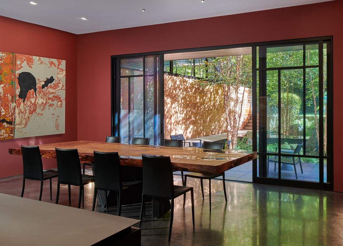 Pivoting — dining room with warm wood and art
